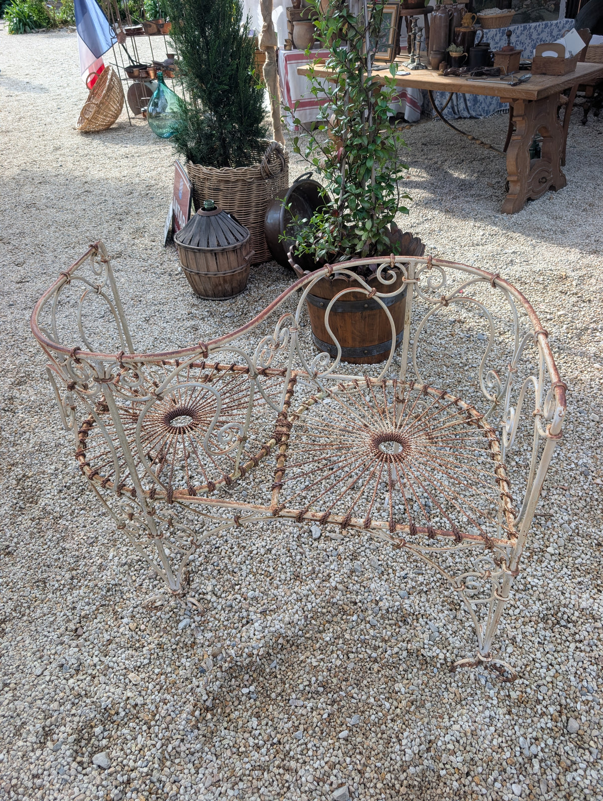Wrought-iron love seat, mid C20th.