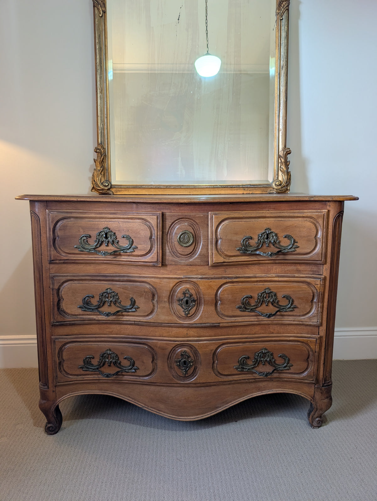 C18th Walnut chest of Drawers with lovers medallion.