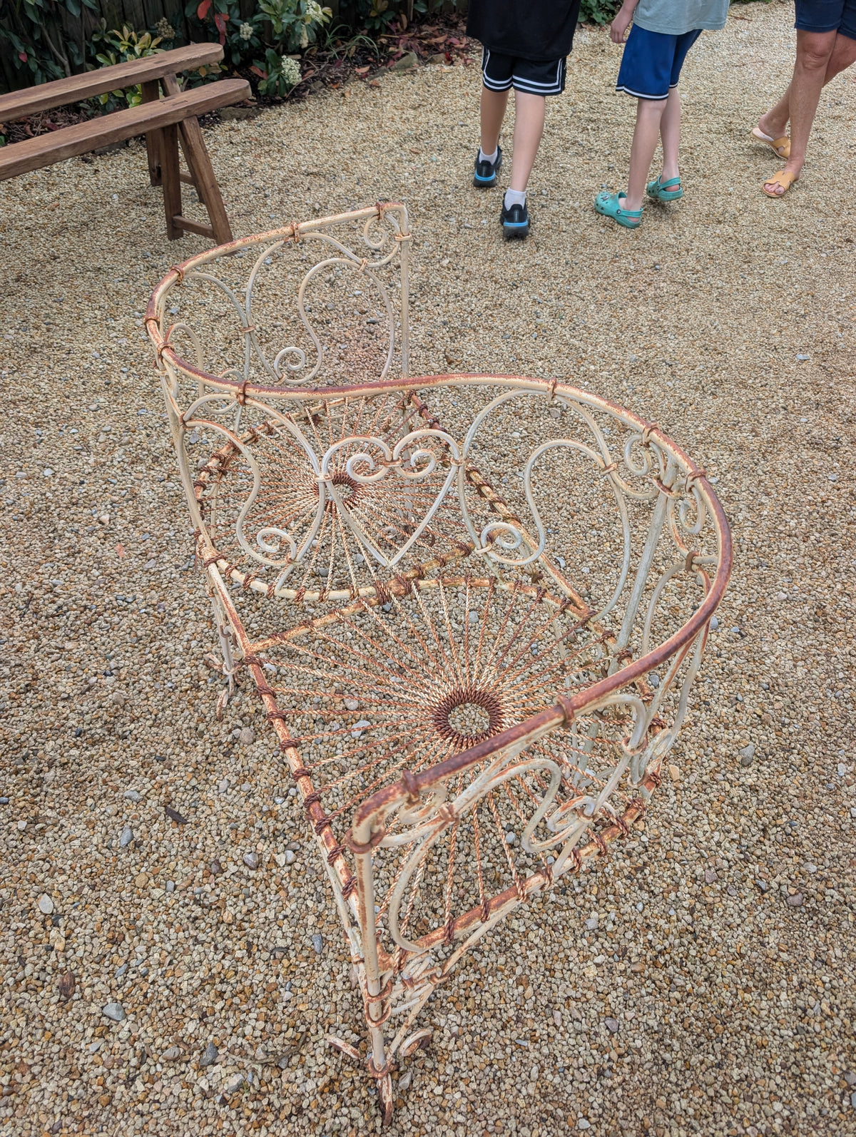 Wrought-iron love seat, mid C20th.