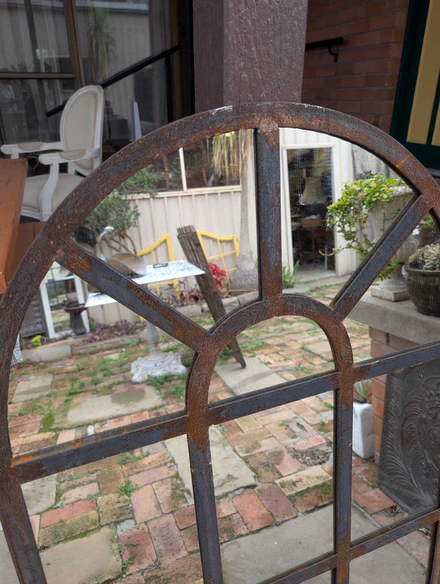 French style arched top wrought iron framed mirror (130 x 65cm)