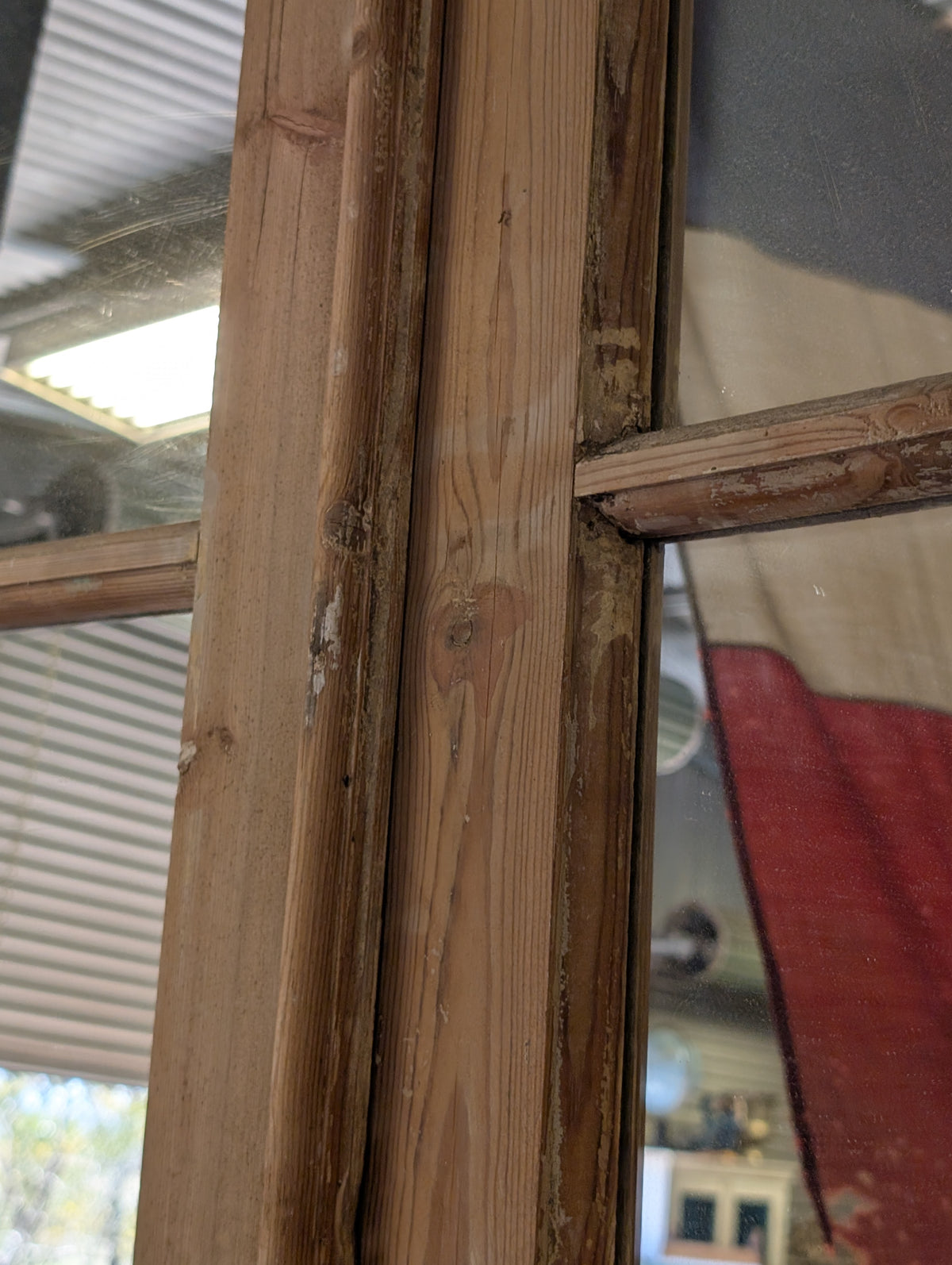 French antique French double doors with a matching top transom door with mirrors in.
