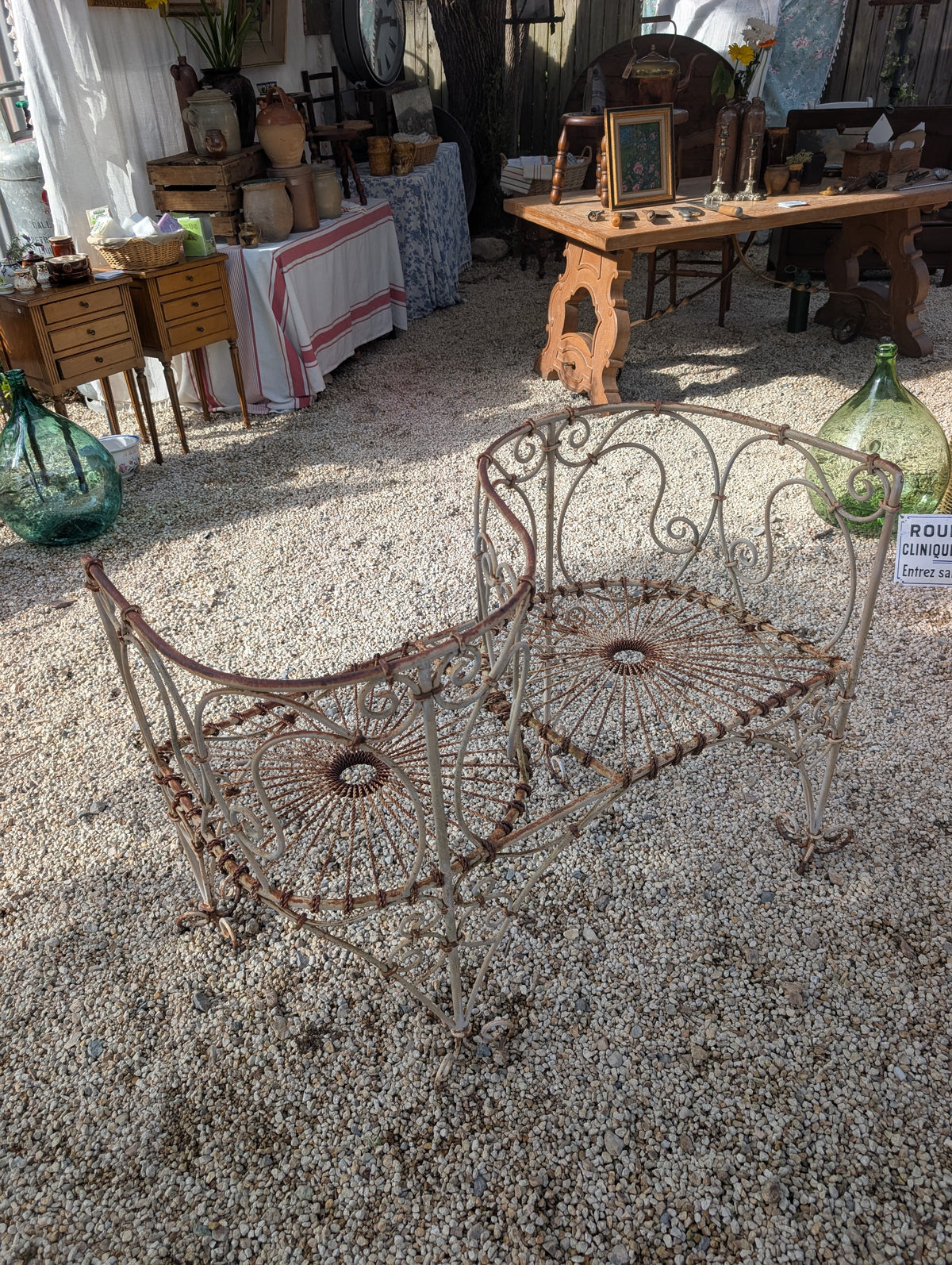 Wrought-iron love seat, mid C20th.