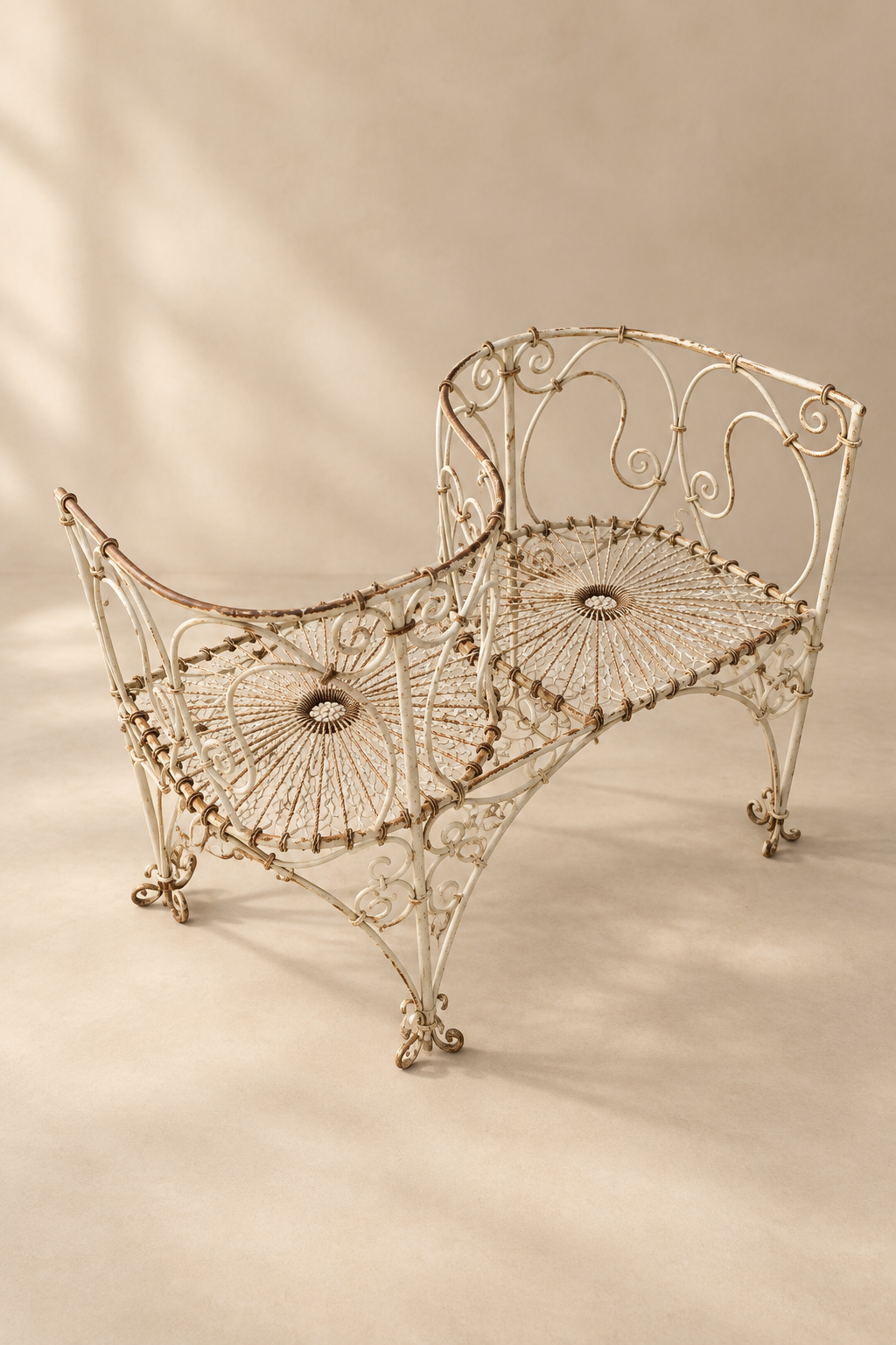 Wrought-iron love seat, mid C20th.