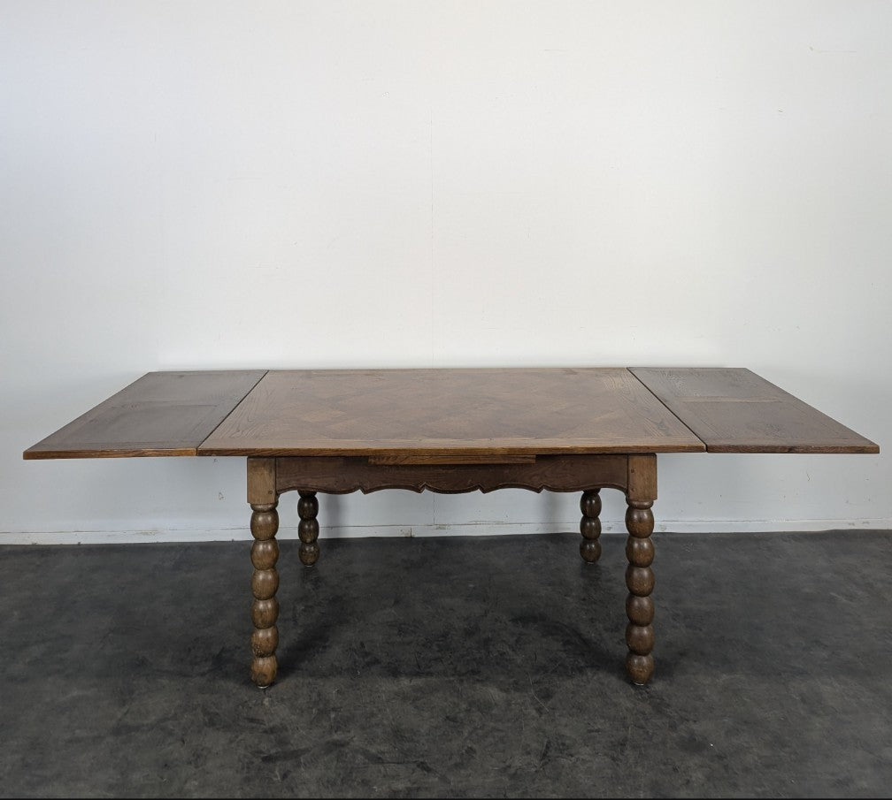 Oak Dining table with spool legs with two extensions